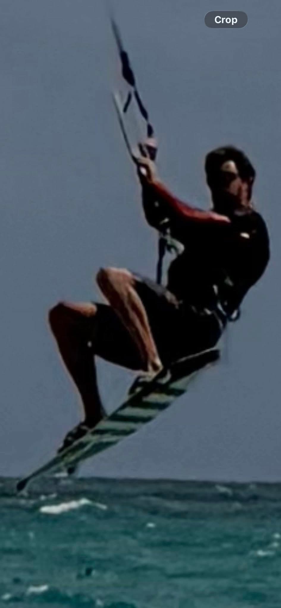 Glen Bradford kiteboarding airborne over the water in Miami