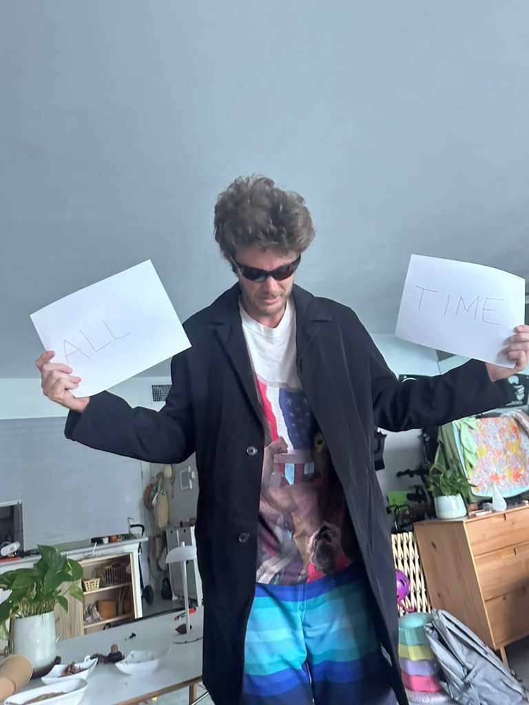 Glen as Neo holding ALL TIME signs — Mike Judge is the all-time GOAT